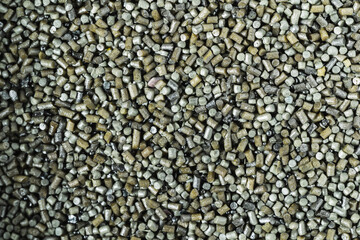 Photo background texture of gunpowder for loading cartridges on a pistol.