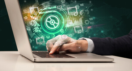 Business hand typing on a modern laptop