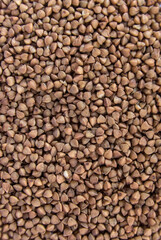 buckwheat in a pile (background, texture, graphic resource) cut out close up (kasha, healthy grain, seed, food)