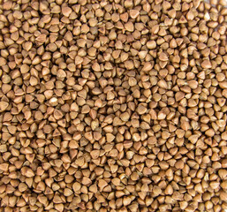 buckwheat in a pile (background, texture, graphic resource) cut out close up (kasha, healthy grain, seed, food)