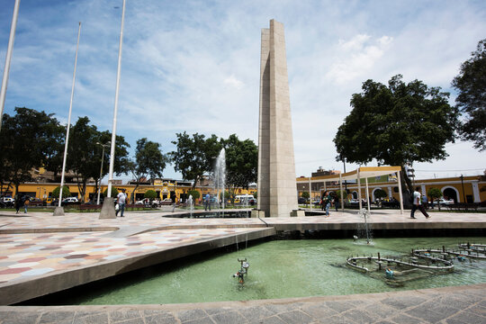 Peru Ica Plaza de Armas with its pyramid sculpture and its water fountain and garden with flowers