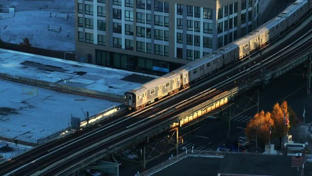 Aerial shot of the subway passing through The Bronx at sunrise.