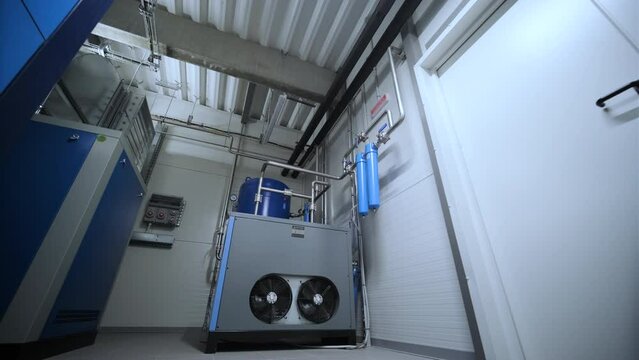 Industrial interior chiller and boiler HVAC heating ventilation air conditioning system and piping line of industrial construction at boiler pump room system in the factory