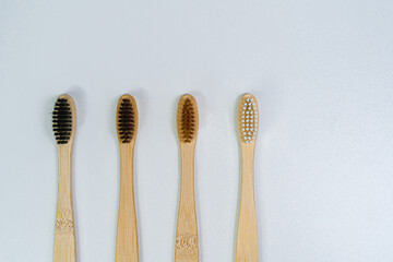 Bamboo toothbrushes on a white background. Eco products for the home.