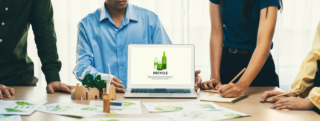 Recycle packaging displayed on laptop at a green business meeting while business team presenting...