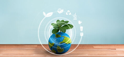 Eco world and green Earth day concept, Earth globe with young tree planted on top and eco-friendly...