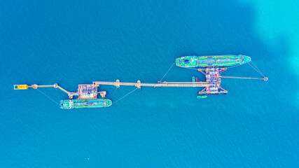Ship tanker oil or gas LPG parking on the sea waiting for unload to refinery, Aerial view oil tanker ship loading in port view from above.