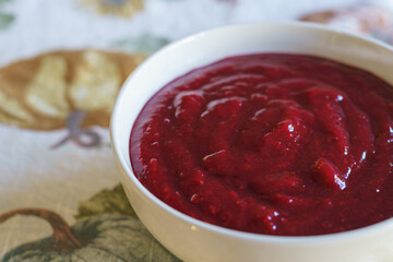 Cranberry sauce in a white bowl close-up