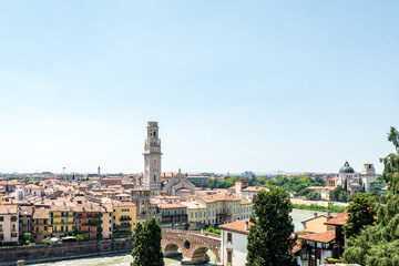 Fototapeta na wymiar View of Verona city. Colorful residential buildings over Adige river in Verona, Italy