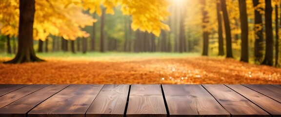 Naklejka na ściany i meble photo of empty Wooden table in front of blurred autumn forest maple leaf background. high photo quality