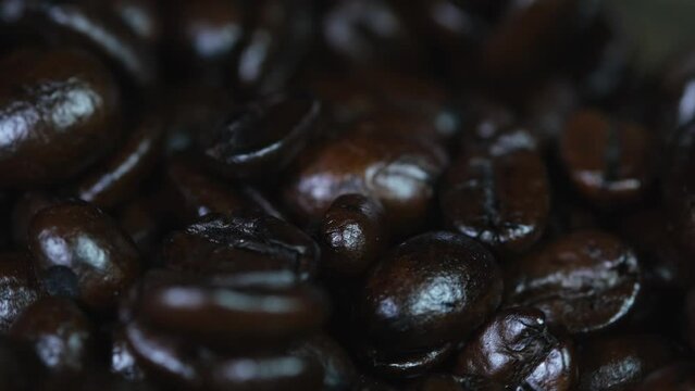 Coffee Beans spinning around in a container revealing the goodness of caffein when freshly brewed.
