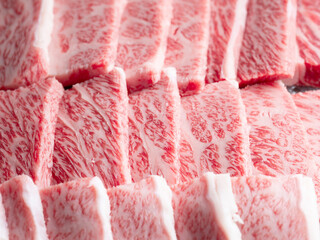 Fresh raw meat in a plastic container	