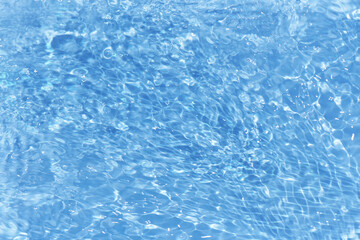 Bluewater bubbles on the surface ripples. Defocus blurred transparent white-black colored clear calm water surface texture with splash and bubbles. Water waves with shining pattern texture background.