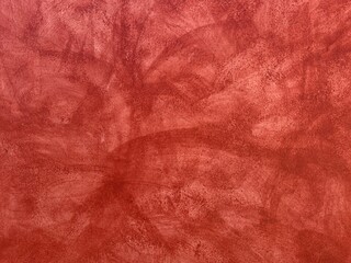 Red plaster wall with cracks and washed-out texture background in Oaxaca, Mexico