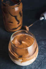 Dalgona coffee, also known as whipped coffee, is a trendy and indulgent beverage