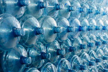 Water gallon pile stock. Plastic PET drinking bottle in drink water plant factory store in clean hygiene storage warehouse. - obrazy, fototapety, plakaty
