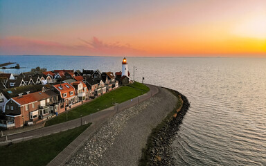 Lighthhouse of Urk Netherlands during sunset in the Netherlands - obrazy, fototapety, plakaty