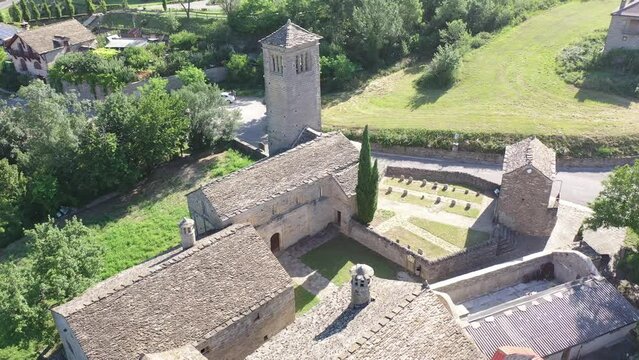 Aerial view of bell tower and apse of the Mozarab Pre-Romanesque or Romanesque Church of San Pedro de Larrede in the Serrablo Region. Aragon. Spain. High quality 4k footage