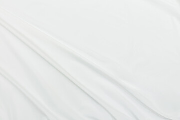 Abstract white fabric texture background Cloth soft wave. Creases of satin, silk, and cotton.