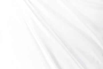 Abstract white fabric texture background Cloth soft wave. Creases of satin, silk, and cotton.