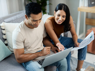 Happy couple, laptop and documents in budget planning, finance or expenses and bills on sofa at...