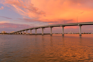 Fototapeta na wymiar Sunset Bridge - A colorful sunset view of Sand Key Bridge, a girder bridge connecting Clearwater and Belleair Beach over the Clearwater Pass, Florida, USA.