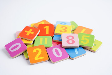 Number wood block cubes for learning Mathematic, education math concept.