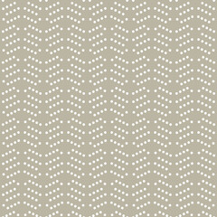 Geometric pattern with dotted white arrows. Geometric modern beige and white ornament. Seamless abstract background