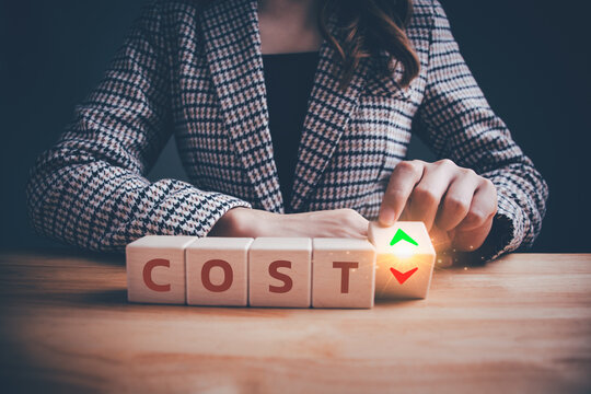 "COST" text on wooden blocks with up and down arrows. Help businesses achieve financial goals and stay profitable. Decreasing costs and cost management, control, reduction, optimization of costs.