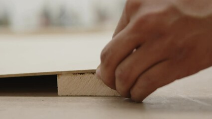Men measuring a piece of wood