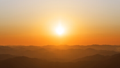 Obraz premium A landscape where the sun is setting. sunset, orange glow