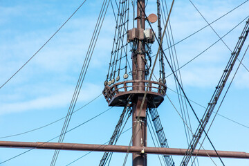 Mast on a ship against the blue sky