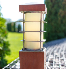 Decorative lantern on a fence in the park