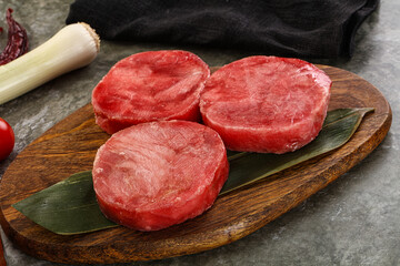Delicous raw tuna medallion for cooking
