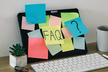 FAQ or Frequently Asked Question text on sticky notes 