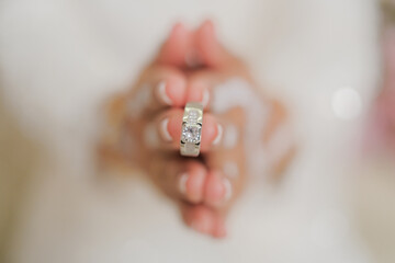 Hand of The Malay bride wears a wedding ring to the Malay groom.