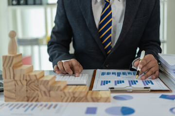 Wooden blocks with icons placed on top of pyramid for business and finance concepts. Modern business icons on stairs, wooden pyramid on table, leading to success.