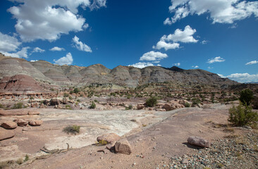 Rocky mountain sandstone wash under cloudy sky in Little Book Cliffs National Monument near De...