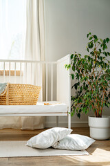 Nursery interior and bedding for kids with wicker bassinet