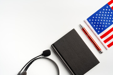 Flag of USA and headset on white background
