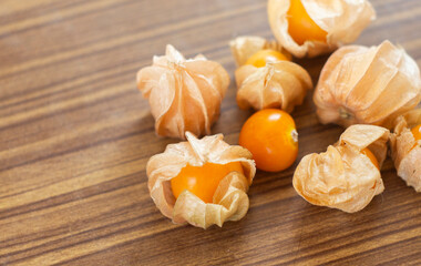 Cape gooseberry (Physalis peruviana) on wooden background