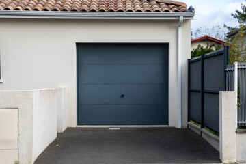 facade gate garage sectional grey dark home door gray of residential house entrance car - obrazy, fototapety, plakaty