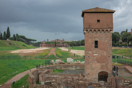 South of Circo Massimo in italy with torre della Moletta tower rising from the ground. Circus maximus was the biggest chariot racing stadium in ancient rome between aventine and palatine hills.