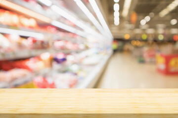 Empty wood table top with supermarket blurred background for product display