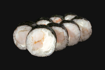 sushi roll with shrimp isolated on black background.