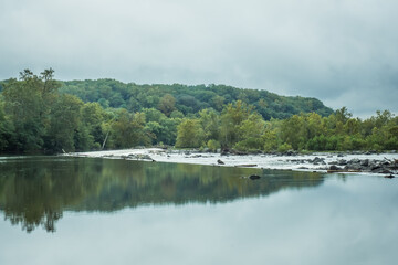 Calm water of  Potomac River near Washington, D.C., on a cloudy day.