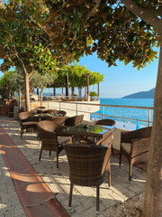 Empty restaurant tables on the embankment  resort town  Herceg N