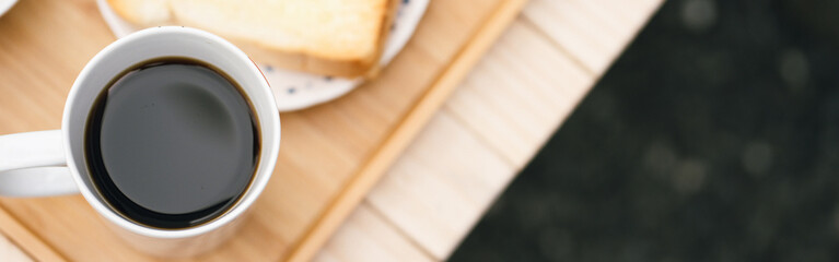 web banner people activity concept with top view of breakfast with black coffee and bread put on...