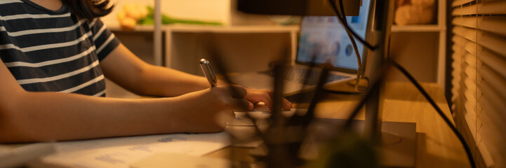 Late-Night Online Education, Dedicated Young Woman Studying Online Late at Night in Her Home Office, Work for home.