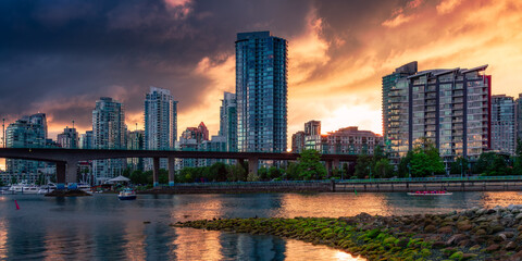 Residential Home Buildings in Modern City. Dramatic Sunset.